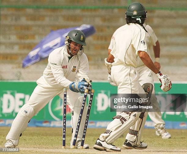 Umar Gul of Pakistan is stumped out by Mark Boucher of South Africa during day three of the first test match between Pakistan and South Africa at the...