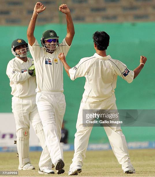 Faisal Iqbal and Abdul Rehman of Pakistan celebrate the wicket of Graeme Smith of South Africa during day three of the first test match between...