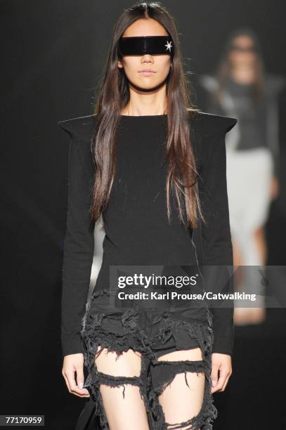 Model walks down the catwalk during the Maison Martin Margiela show as part of Paris Fashion Week Spring/Summer 2008 on Septmeber 30, 2007 in Paris,...