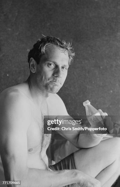 British Olympic gold medal winning rower Steve Redgrave pictured holding a bottle of Evian water during a training session in England on 6th May 1991.