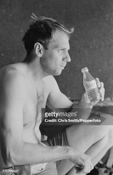 British Olympic gold medal winning rower Steve Redgrave pictured holding a bottle of Evian water during a training session in England on 6th May 1991.