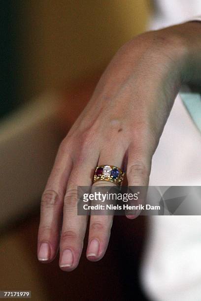 Marie Cavallier shows her engagement ring during a press conference attended with Prince Joachim of Denmark to announce their engagement, at the...