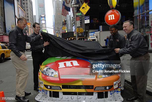 Brice Russell, Kyle Busch, William Clements and Jimmy Makar unveil the new 2008 M&M's Racing Toyota Camry of Kyle Busch outside M&M's World in Times...