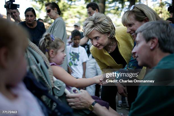 Democratic presidential hopeful New York Senator Hillary Rodham Clinton and her husband former president Bill Clinton visit the 92nd Annual Hopkinton...