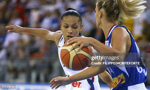 France's Edwige Lawson-Wade vies with Milica Dabovic during their Group F qualifying round of the Women European Basketball Championships at Ortona's...