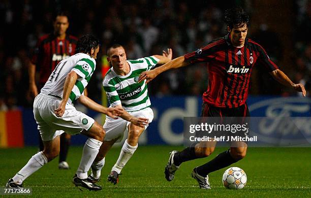 Scott Brown and Paul Hartley of Celtic tackle Kaka of AC Milan during the UEFA Champions League match between Celtic and AC Milan at Celtic Park...