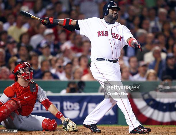 David Ortiz of the Boston Red Sox hits a two run homer in the third inning as Mike Napoli of the Los Angeles Angels of Anaheim catches during game...