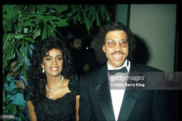 Singer Lionel Ritchie and wife pose at the 7th Annual American Cinema Awards January 27, 1990 at the Beverly Hilton Hotel in Los Angeles, CA. Billed...