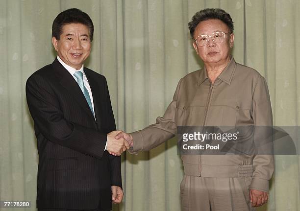 South Korea's President Roh Moo-Hyun and North Korea's leader Kim Jong-Il shake hands after they exchanged their joint statement on October 4, 2007...
