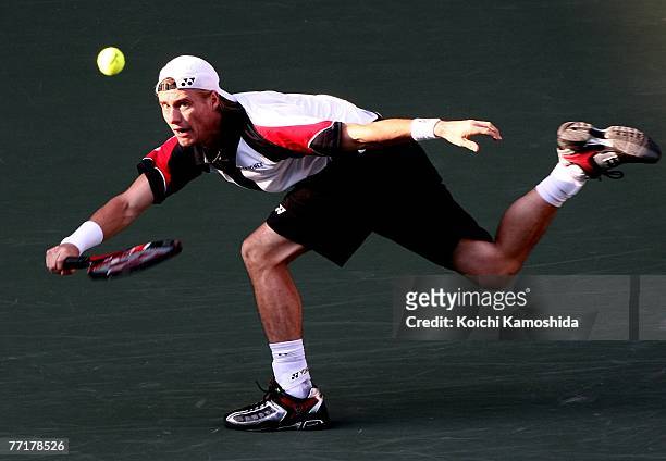 Lleyton Hewitt of Australia hits a return shot against Ivan Navarro Pastor of Spain during Day 4 of the AIG Japan Open Tennis Championships held at...