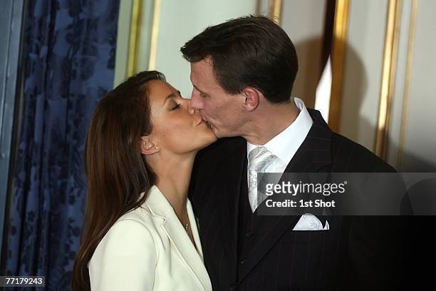 His Royal Highness Prince Joachim of Denmark and Miss Marie Cavallier kiss during a press conference to announce their engagement at the Riddersalen...