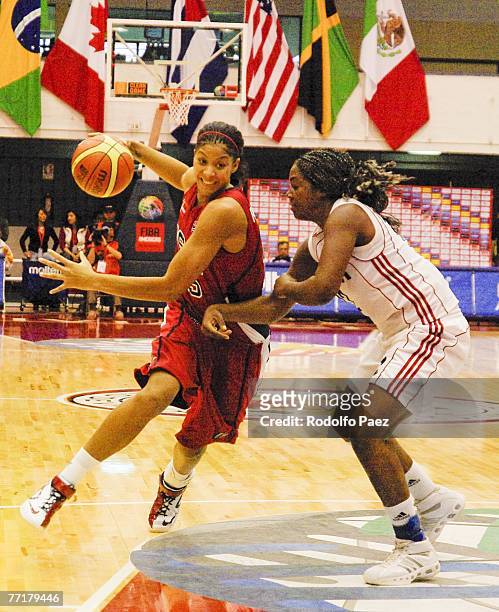 Candace Parker of USA tries to avoid Clenia Noblet Salazar of Cuba during the women's FIBA Americas Championship at the Arena on September 30, 2007...