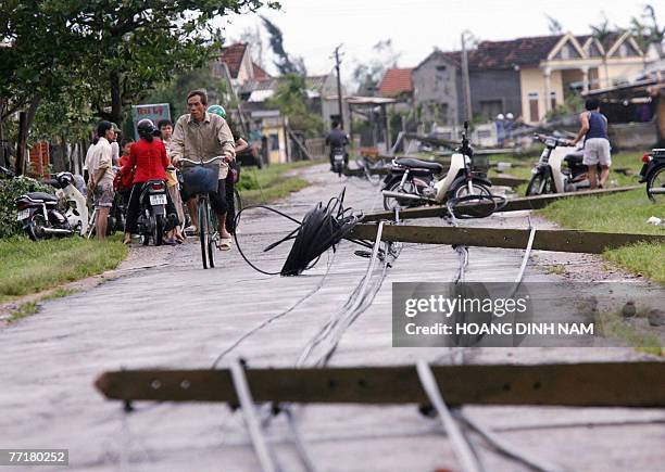 An electrical pole is seen having fallen down after the passage of tropical storm Lekima, at Ky Anh district, in the central province of Ha Tinh, 04...