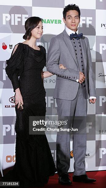 Actress UKim Tae-Hee and Lee Gyu-Hwan arrive at the opening ceremony of the 12th Pusan International Film Festival on October 4, 2007 in Pusan, South...