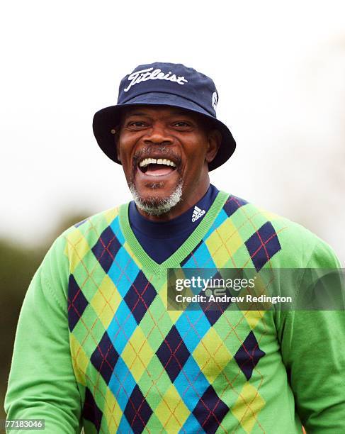 Hollywood film star Samuel L.Jackson shares a joke with his playing partner Michael Campbell of New Zealand during the first round of the Alfred...