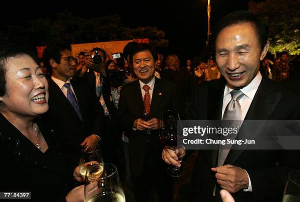 Lee Myung-Bak, right, the presidential candidate from the Grand National Party attends the opening ceremony party for the 12th Pusan International...