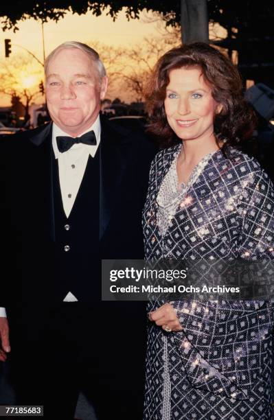 Country singer Loretta Lynn poses for a portrait with her husband Mooney Lynn at the Academy Awards Ceremony, where the biographical film "Coal...