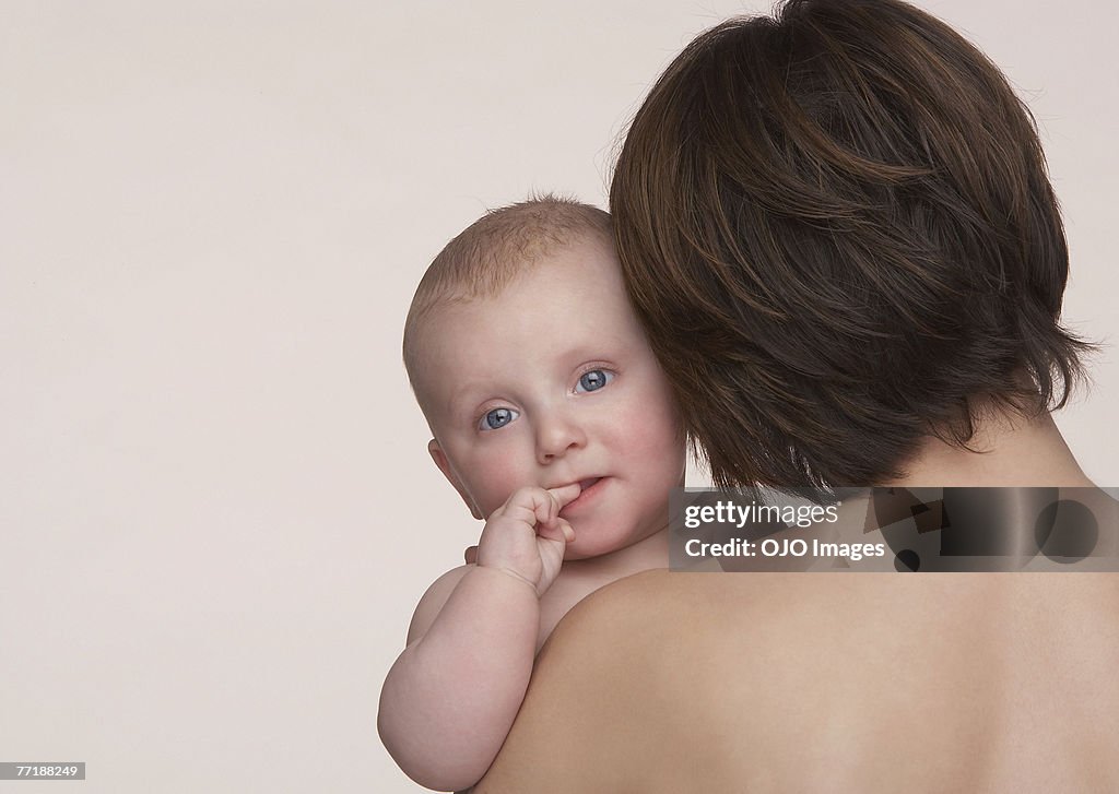 A woman holding a baby