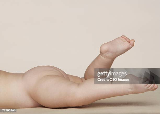 a baby's bottom and legs - cute bums stock pictures, royalty-free photos & images