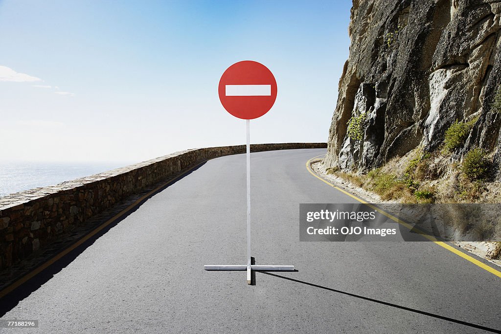A single street sign on a desolate road