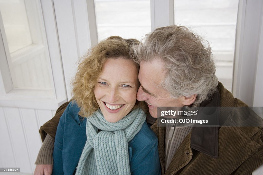 A couple on a boardwalk at the beach
