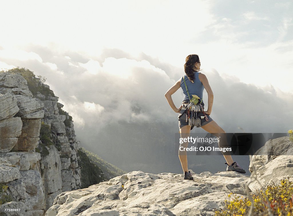 A woman climber on top of a mountain