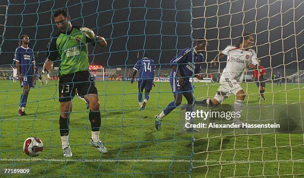 Hamit Altintop of Munich celebrates scoring the second goal during the first round second leg UEFA cup match between Belenenses Lisbonat and Bayern...