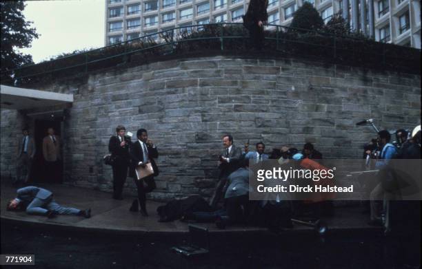 Chaos surrounds shooting victims immediately after the assassination attempt on President Reagan, March 30 by John Hinkley Jr. Outside the Hilton...