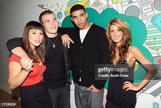 DeGrassi High" cast members Cassie Steele, Shane Kippel, Aubrey Graham, and Shenae Grimes pose for a photo backstage during MTV's Total Request Live...