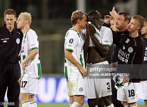 Groningen defender of Sierra Leone Gibril Sankoh and teammates react after losing to Fiorentina during UEFA Cup second leg football match at Artemio...