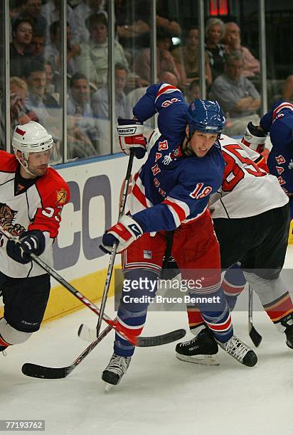 Playing in his first NHL game, Marc Staal of the New York Rangers moves the puck away from the Florida Panthers on October 4, 2007 at Madison Square...