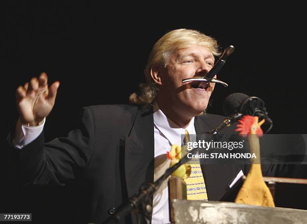 Dan Meyer of Antioch, Tennessee demonstrates sword swallowing after he and radiologist Brian Witcombe of Gloucester, Britain were awarded a 2007 Ig...