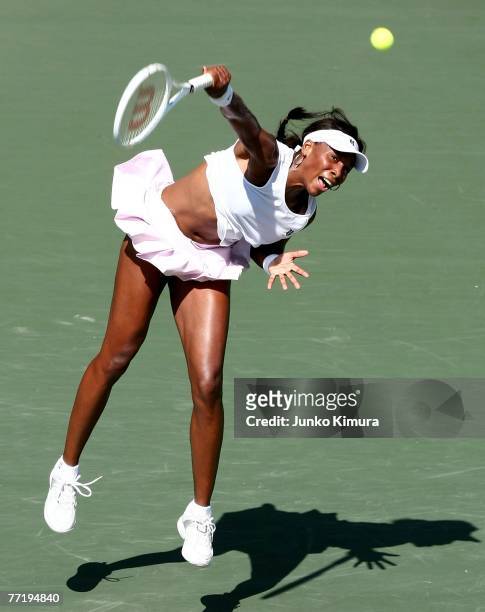 Venus Williams of the USA hits serves against Caroline Wozniacki of Denmark during day five of the AIG Japan Open Tennis Championships held at Ariake...