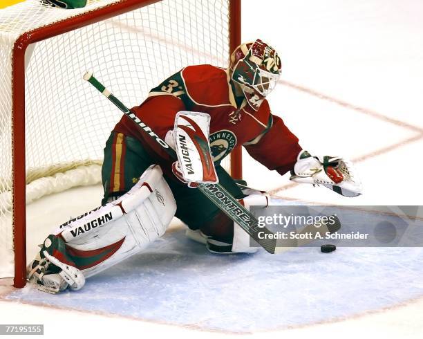 Niklas Backstrom of the Minnesota Wild makes one of his 27 saves in a shutout of the Chicago Blackhawks October 4, 2007 at the Xcel Energy Center in...