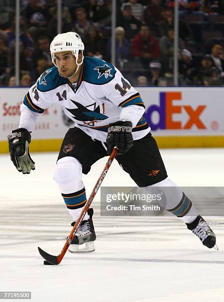 October 4: Jonathan Cheechoo of the San Jose Sharks carries the puck up the ice against the Edmonton Oilers during the Oilers home opener on October...