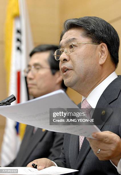 South Korean Unification Minister Lee Jae-Joung speaks as Finance and Economy Minister Kwon O-Kyu listens during a joint press conference at the...