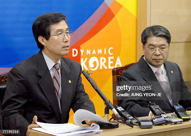 South Korean Finance and Economy Minister Kwon O-Kyu speaks as Unification Minister Lee Jae-Joung listens during a joint press conference at the...