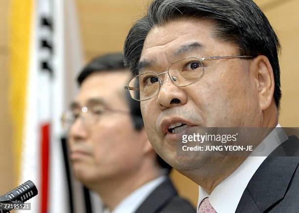 South Korean Unification Minister Lee Jae-Joung speaks as Finance and Economy Minister Kwon O-Kyu listens during a joint press conference at the...