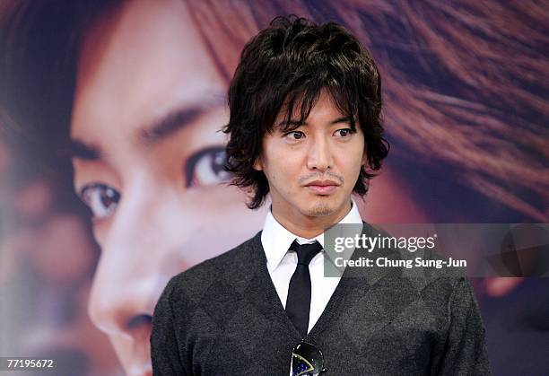 Actor Takuya Kimura attend a photocall after his news conference at the premiere of 'HERO' at the 12th Pusan International Film Festival October 5,...