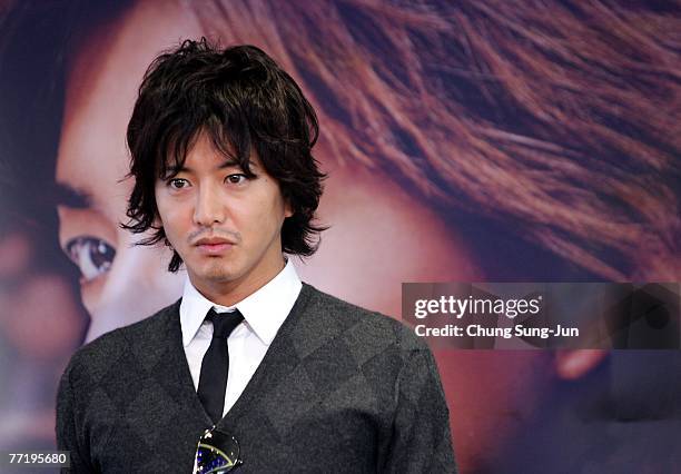 Actor Takuya Kimura attends a photocall after a press conference at the premiere of 'HERO' at the 12th Pusan International Film Festival October 5,...