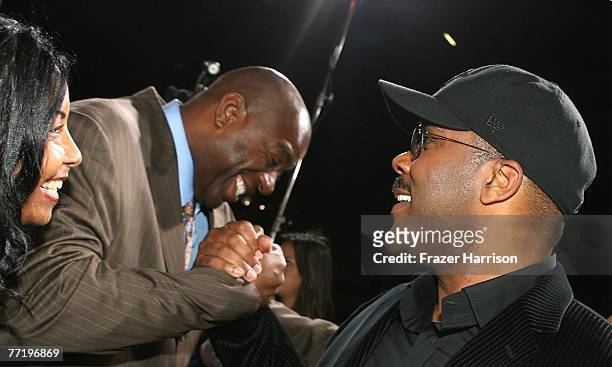Sportsman Earvin "Magic" Johnson, wife Cookie and actor and director Tyler Perry at Lionsgate's Premiere Of "Why Did I Get Married?" held at the The...
