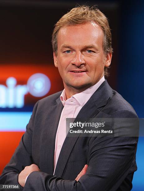 Presenter Frank Plasberg poses during the photo call for the political talkshow "hart aber fair" at the City Globe Studio on October 5, 2007 in...