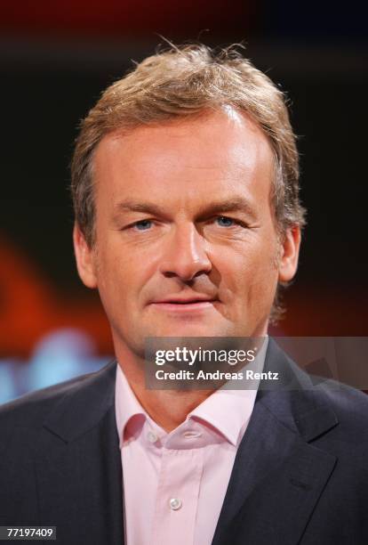 Presenter Frank Plasberg looks on during the photo call for the political talkshow "hart aber fair" at the City Globe Studio on October 5, 2007 in...