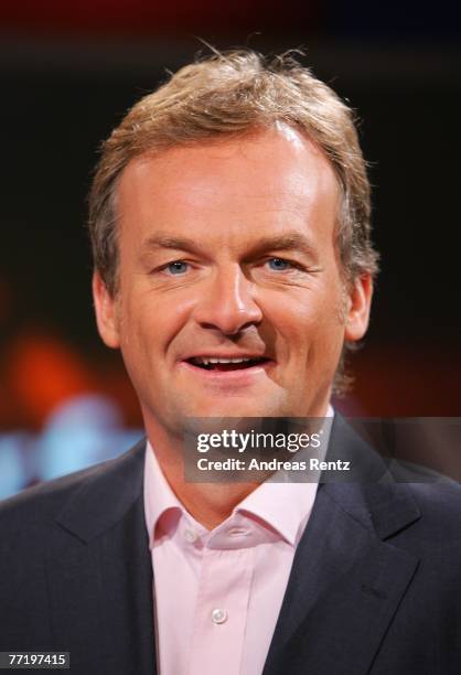 Presenter Frank Plasberg looks on during the photo call for the political talkshow "hart aber fair" at the City Globe Studio on October 5, 2007 in...