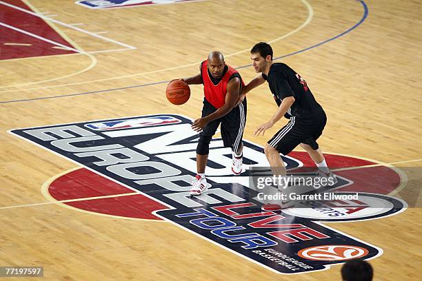 Darrick Martin brings the ball up court against Jose Calderon of the Toronto Raptors during practice as part of the 2007 NBA Europe Live Tour on...