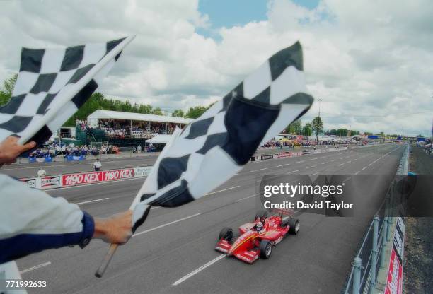 Alex Zanardi of Italy driving the Target Ganassi Racing Reynard 96i Honda takes the chequered flag to win the Championship Auto Racing Teams 1996 PPG...