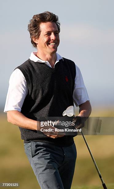Film actor Hugh Grant on the 17th green during second round the Alfred Dunhill Links Championship at The Old Course on October 5, 2007 in St Andrews,...