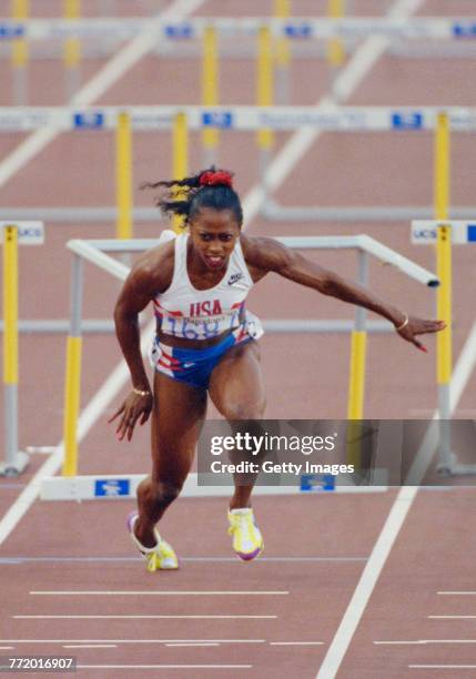 Gail Devers of the United States stumbles and falls across the finishing line after clipping the10th hurdle in the Women's 100 metres Hurdles final...