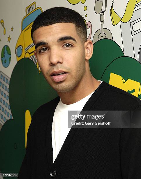 Actor Aubrey Graham of the cast of "DeGrassi High" of "DeGrassi High" pose for pictures while visiting MTV's "TRL" at MTV Studios in Times Square on...