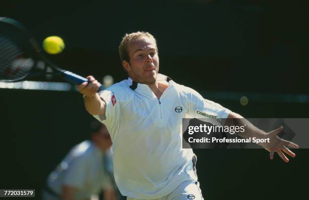 Belgian tennis player Olivier Rochus pictured in action during competition to reach the third round of the Men's Singles tournament at the Wimbledon...